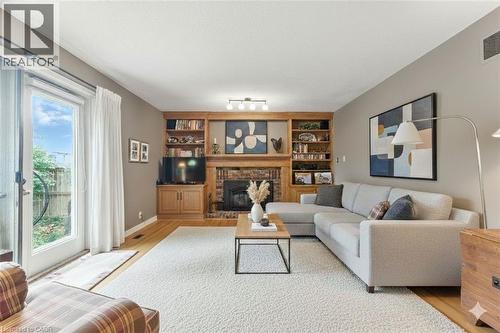 VIRTUALLY STAGED - Family Room - 3 Atkins Drive, Hamilton, ON - Indoor Photo Showing Living Room With Fireplace