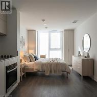Bedroom featuring dark wood-type flooring - 