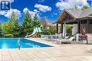 Outdoor pool with a patio area and a water slide - 86 Canters Close, Kitchener, ON  - Outdoor With In Ground Pool With Deck Patio Veranda 