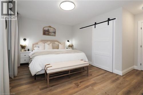 Bedroom featuring a barn door and wood finished floors - 238 Eagle Street S, Cambridge, ON - Indoor Photo Showing Bedroom