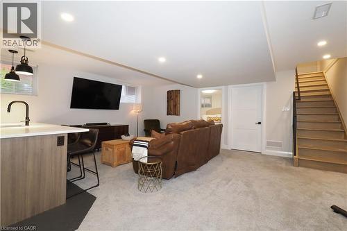 Living room featuring stairs, light colored carpet, and recessed lighting - 238 Eagle Street S, Cambridge, ON - Indoor
