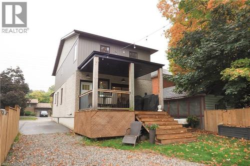 Rear view of property with brick siding, a wooden deck, and stairway - 238 Eagle Street S, Cambridge, ON - Outdoor With Deck Patio Veranda