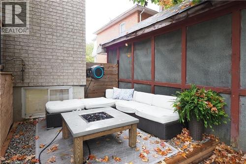 View of patio / terrace with an outdoor living space with a fire pit and a sunroom - 238 Eagle Street S, Cambridge, ON -  With Exterior