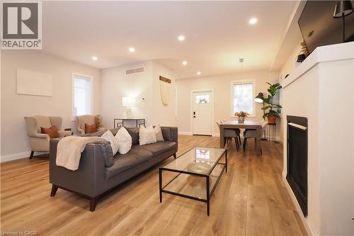 Living area featuring recessed lighting, light wood finished floors, and a fireplace - 238 Eagle Street S, Cambridge, ON - Indoor Photo Showing Living Room