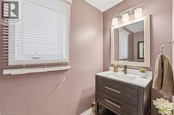 Bathroom featuring vanity and baseboards - 