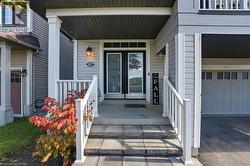 Property entrance with a porch and a garage - 