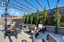 Fenced backyard featuring an outdoor hangout area, a patio, and a pergola - 