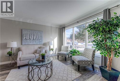 Living room with baseboards and wood finished floors - 156 Donald Street, Kitchener, ON - Indoor Photo Showing Living Room