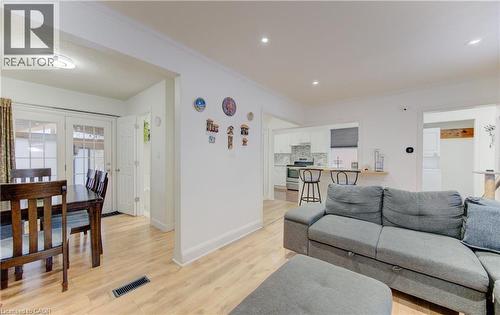 Living area with light wood-style floors and crown molding - 569 Stirling Avenue S, Kitchener, ON - Indoor Photo Showing Living Room