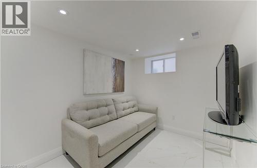 Living room with marble finish floors and recessed lighting - 569 Stirling Avenue S, Kitchener, ON - Indoor