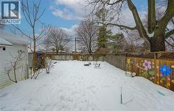 Snowy yard with a fenced backyard - 
