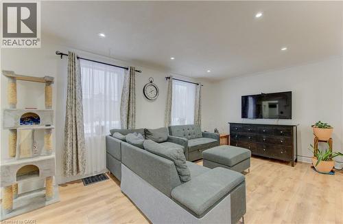 Living area with light wood-type flooring, recessed lighting, and crown molding - 569 Stirling Avenue S, Kitchener, ON - Indoor Photo Showing Living Room