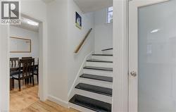 Stairs with wood finished floors and baseboards - 