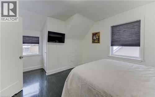 Bedroom with dark wood-style floors and lofted ceiling - 569 Stirling Avenue S, Kitchener, ON - Indoor Photo Showing Bedroom
