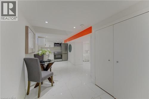 Hallway with recessed lighting and light marble finish floors - 569 Stirling Avenue S, Kitchener, ON - Indoor Photo Showing Other Room