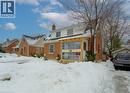 View of front of home featuring a chimney and brick siding - 569 Stirling Avenue S, Kitchener, ON  - Outdoor With Facade 