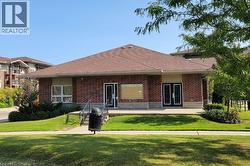 View of Amenities Building with fitness centre and party room. - 