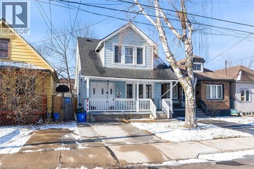 View of front facade featuring a porch and a shingled roof - 35 Bayfield Avenue, Hamilton, ON - Outdoor With Deck Patio Veranda With Facade