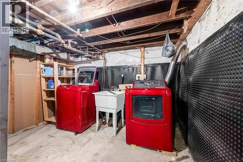 Unfinished below grade area featuring washer and clothes dryer and a sink - 35 Bayfield Avenue, Hamilton, ON - Indoor Photo Showing Other Room