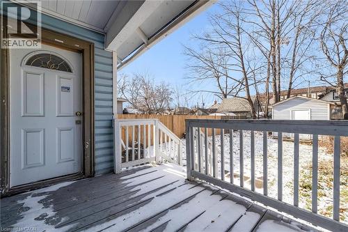 Wooden terrace featuring a fenced backyard, a residential view, and a shed - 35 Bayfield Avenue, Hamilton, ON - Outdoor With Deck Patio Veranda