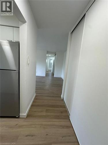 Corridor with light wood-style floors and baseboards - 145 Macgregor Crescent Unit# 1, Waterloo, ON - Indoor Photo Showing Other Room
