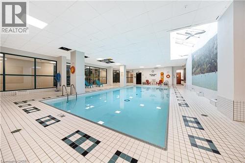 100 Millside Drive Unit# Ss01, Milton, ON - Indoor Photo Showing Other Room With In Ground Pool