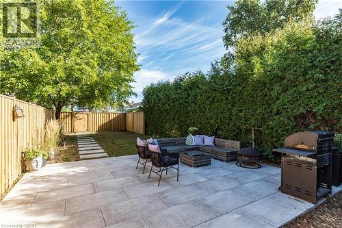 Fenced backyard with outdoor lounge area, a patio, and area for grilling - 58 Chatham Street, Hamilton, ON - Outdoor With Deck Patio Veranda