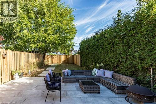 Fenced backyard featuring a patio area and an outdoor living space - 58 Chatham Street, Hamilton, ON - Outdoor With Deck Patio Veranda