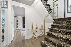 Stairs with wood finished floors and french doors - 