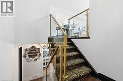 Stairway with wood finished floors and baseboards - 