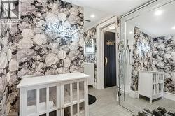 Bathroom with a marble finish shower, recessed lighting, and a closet - 