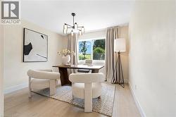 Dining space featuring a chandelier and light wood-style floors - 