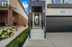 Entrance to property featuring stucco siding - 