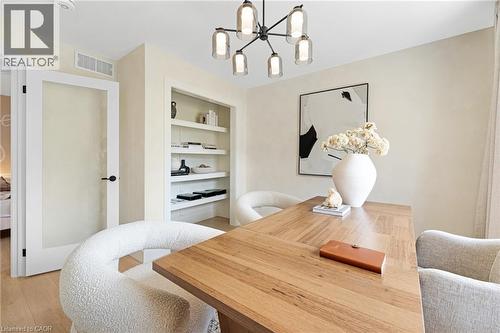 Office space with built in features, a chandelier, and light wood-style flooring - 452 Westhaven Street, Waterloo, ON - Indoor Photo Showing Other Room