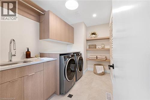 Washroom with independent washer and dryer, cabinet space, and recessed lighting - 452 Westhaven Street, Waterloo, ON - Indoor Photo Showing Laundry Room