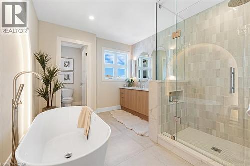 Full bathroom with vanity, a shower stall, a soaking tub, and tile patterned floors - 452 Westhaven Street, Waterloo, ON - Indoor Photo Showing Bathroom