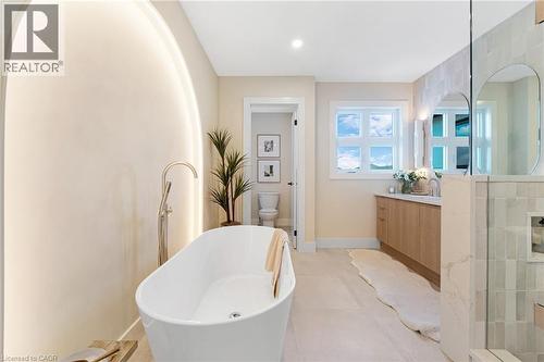 Full bath with vanity, a freestanding bath, recessed lighting, tile patterned flooring, and a shower - 452 Westhaven Street, Waterloo, ON - Indoor Photo Showing Bathroom