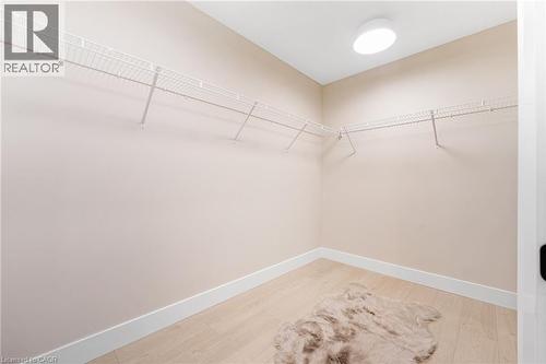 Spacious closet featuring light wood-style floors - 452 Westhaven Street, Waterloo, ON - Indoor With Storage