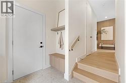 Mudroom featuring baseboards and recessed lighting - 