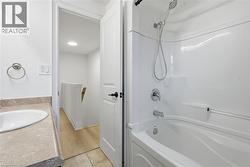 Updated, 4 piece bathroom with low maintenance tub surround & oversized vanity. - 