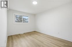 Primary Bedroom with laminate flooring, LED lighting window and closet. - 