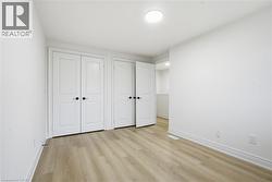 Primary Bedroom with laminate flooring, LED lighting window and closet. - 