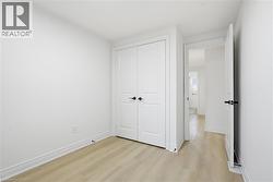 Bedroom 2 with laminate flooring, LED lighting window and closet. - 