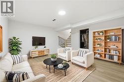 Virtually Staged family room in basement is awesome for entertaining & finished beautifully. - 