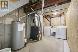 Separate laundry area combined with utility room. - 