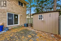 Private rear patio area is fully fenced with shed for extra storage. - 