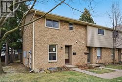 Lovely, end unit 3+1BR all brick townhome shaded by mature trees. - 