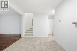 Spacious dining area overlooks main floor living room. Easily fits a family size table, features tile flooring for easy maintenance & clean up. - 