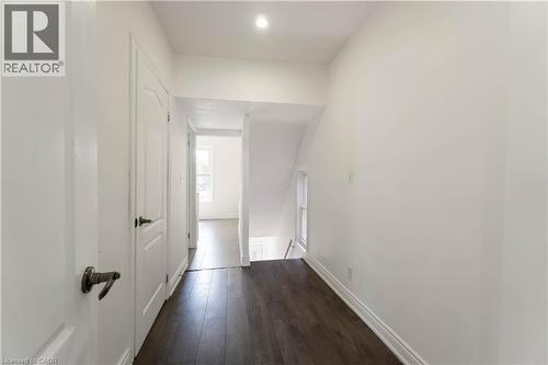 Corridor featuring dark wood-style floors and an upstairs landing - 934 Barton Street E Unit# 2, Hamilton, ON - Indoor Photo Showing Other Room