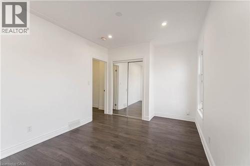 Unfurnished bedroom with dark wood finished floors, recessed lighting, and a closet - 934 Barton Street E Unit# 2, Hamilton, ON - Indoor Photo Showing Other Room